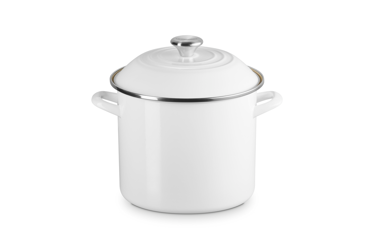 Three quarter view of 8 quart stockpot in White showcasing fitted lid and side handles against a gray background