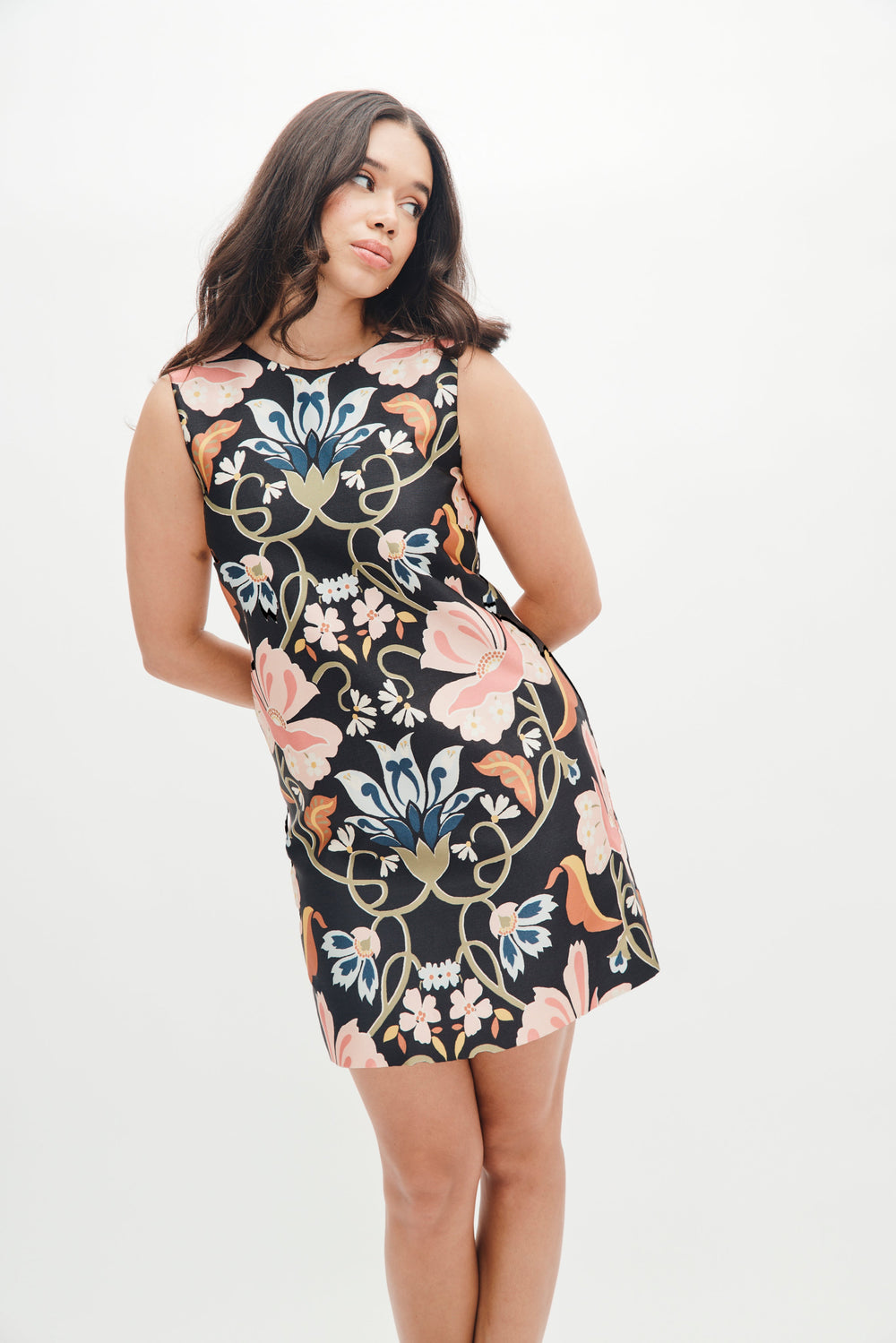 Front view of Laurel Dress in Floral Vines showcasing sleeveless shift silhouette and large pink, blue, and gold floral print on black against a white studio background