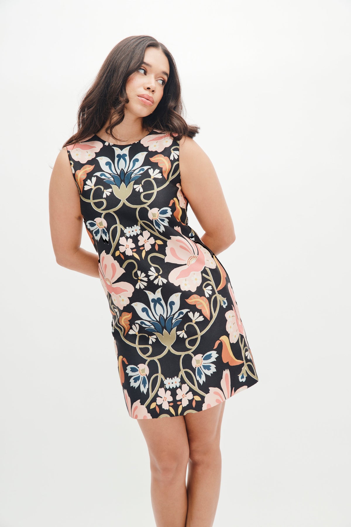 Front view of Laurel Dress in Floral Vines showcasing sleeveless shift silhouette and large pink, blue, and gold floral print on black against a white studio background