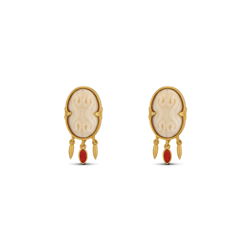 Front view of The Cinched Cameo Earrings with hand-carved bone cameos in gold frames and red carnelian drops on white