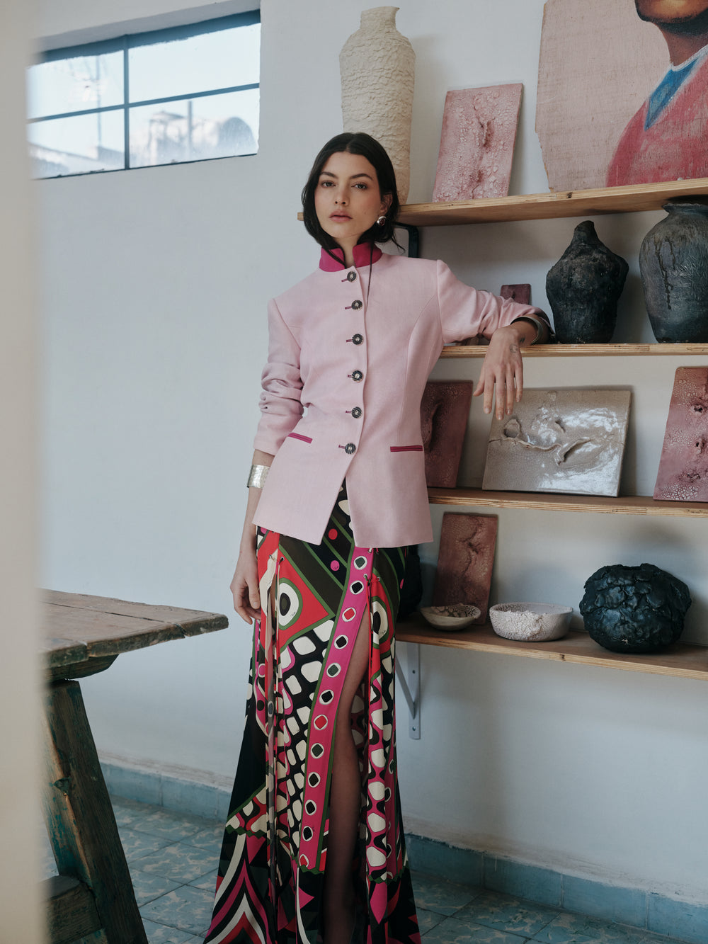 Front view of Louise Chérie pink linen jacket on model showcasing longer tailored silhouette, horn buttons, and magenta trim