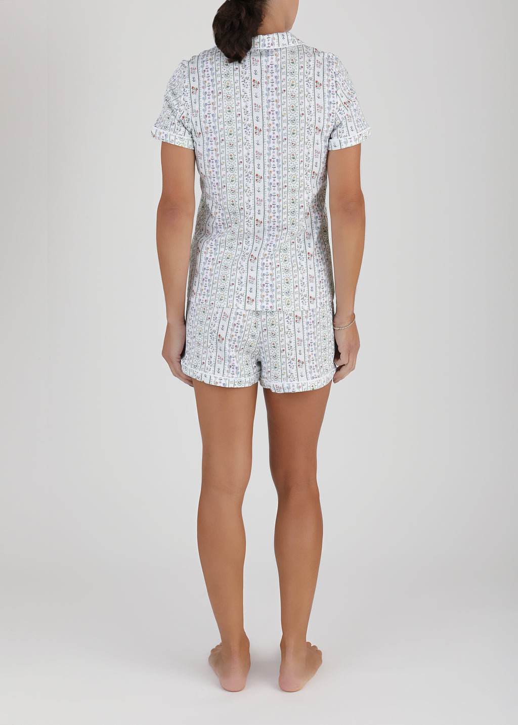 Back view of Women’s Garden Party Short Pajama Set showcasing its floral print and shorts with a light studio background