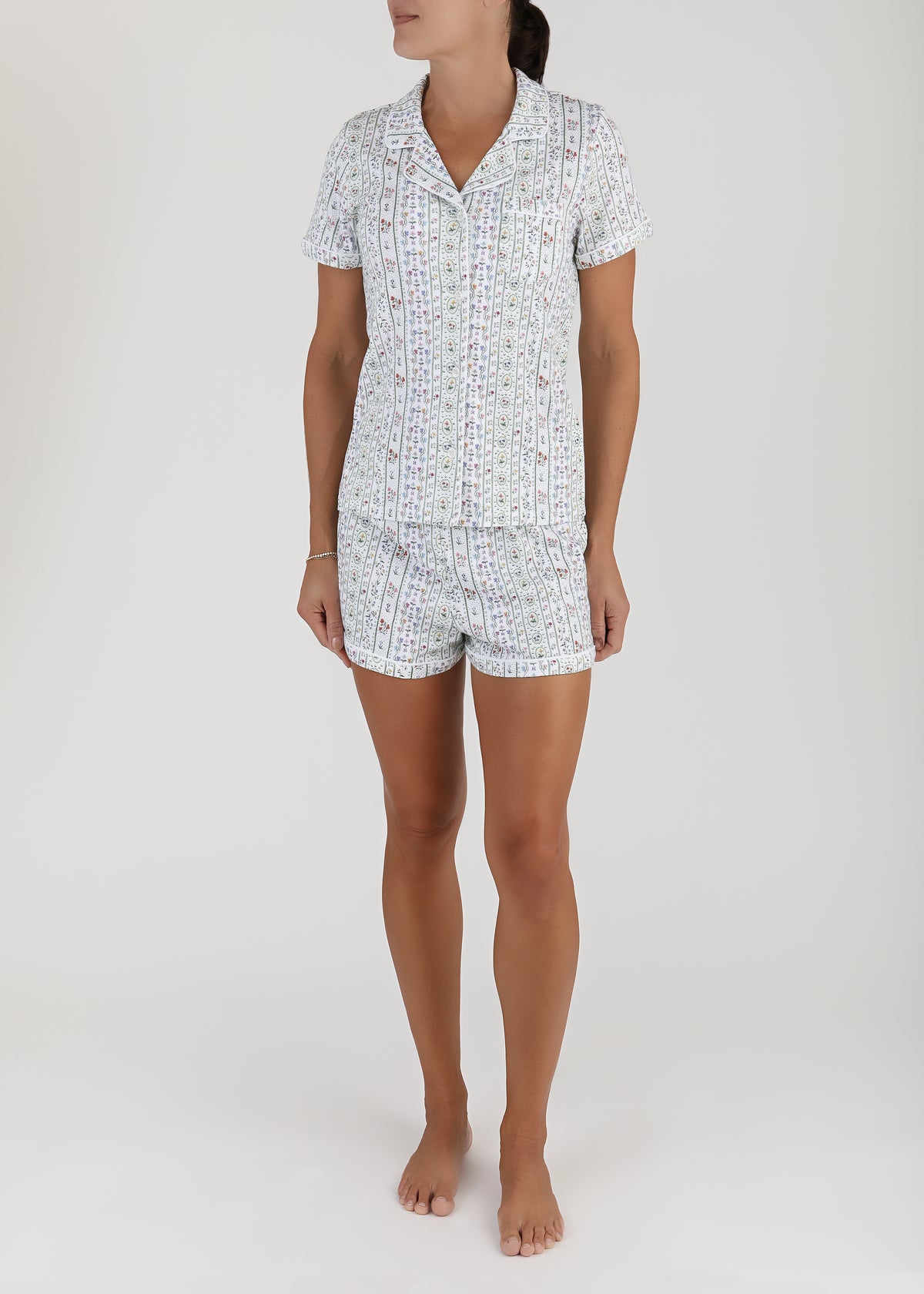 Front view of Women’s Garden Party Short Pajama Set showcasing a whimsical floral print with a white background
