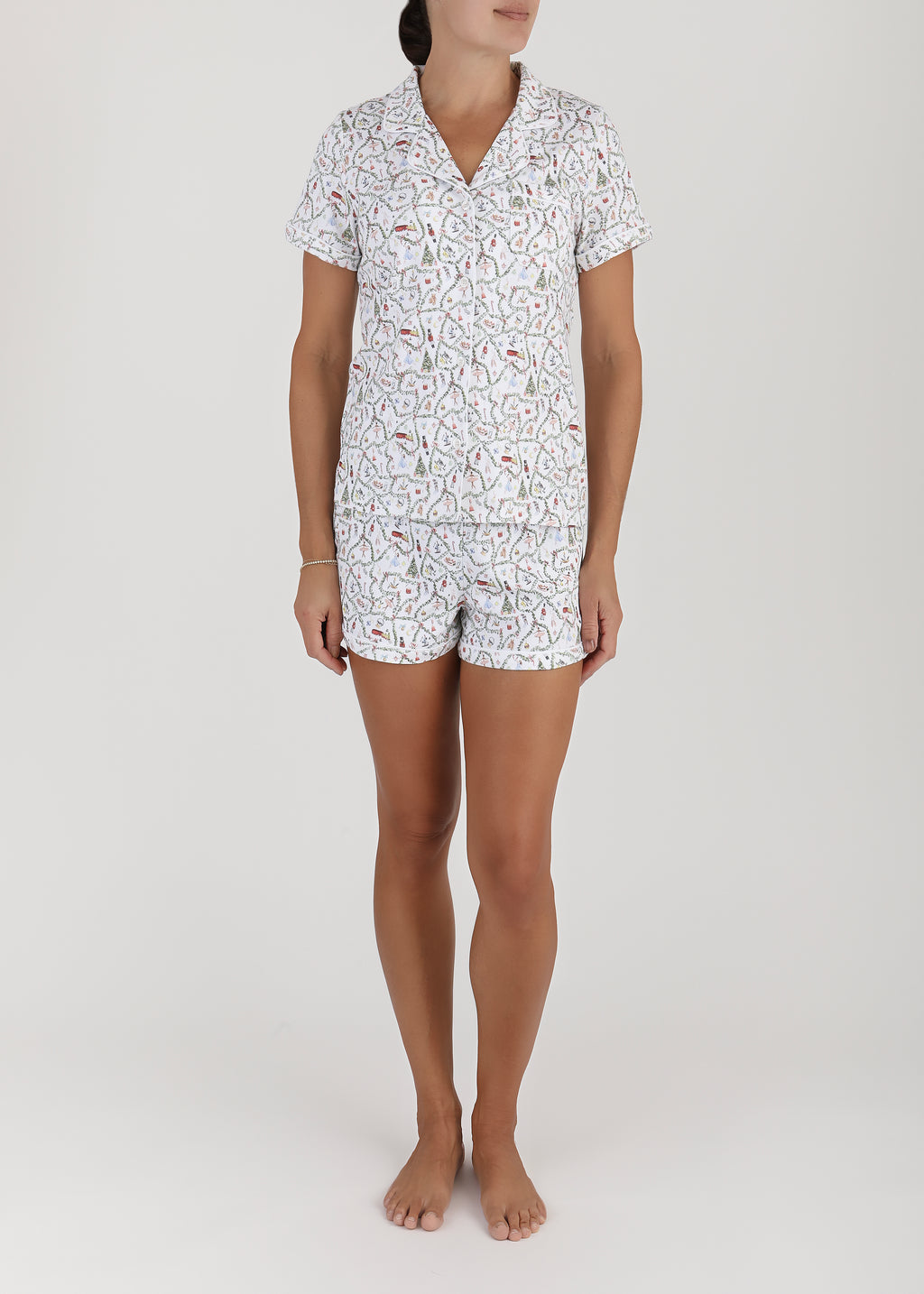 Front view of Women’s Nutcracker Suite Short Pajama Set showcasing a patterned top and matching shorts on a model