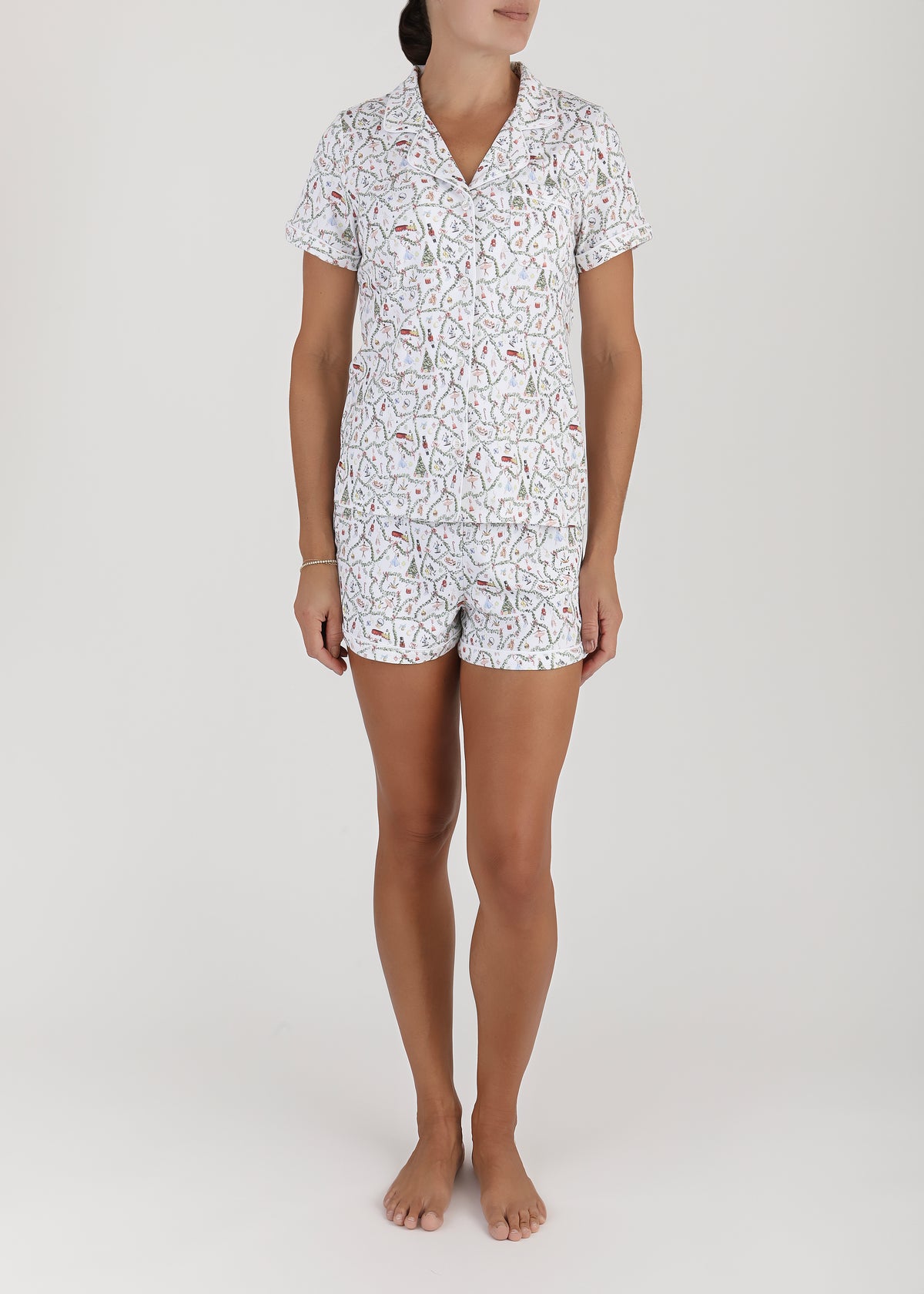 Front view of Women’s Nutcracker Suite Short Pajama Set showcasing a patterned top and matching shorts on a model
