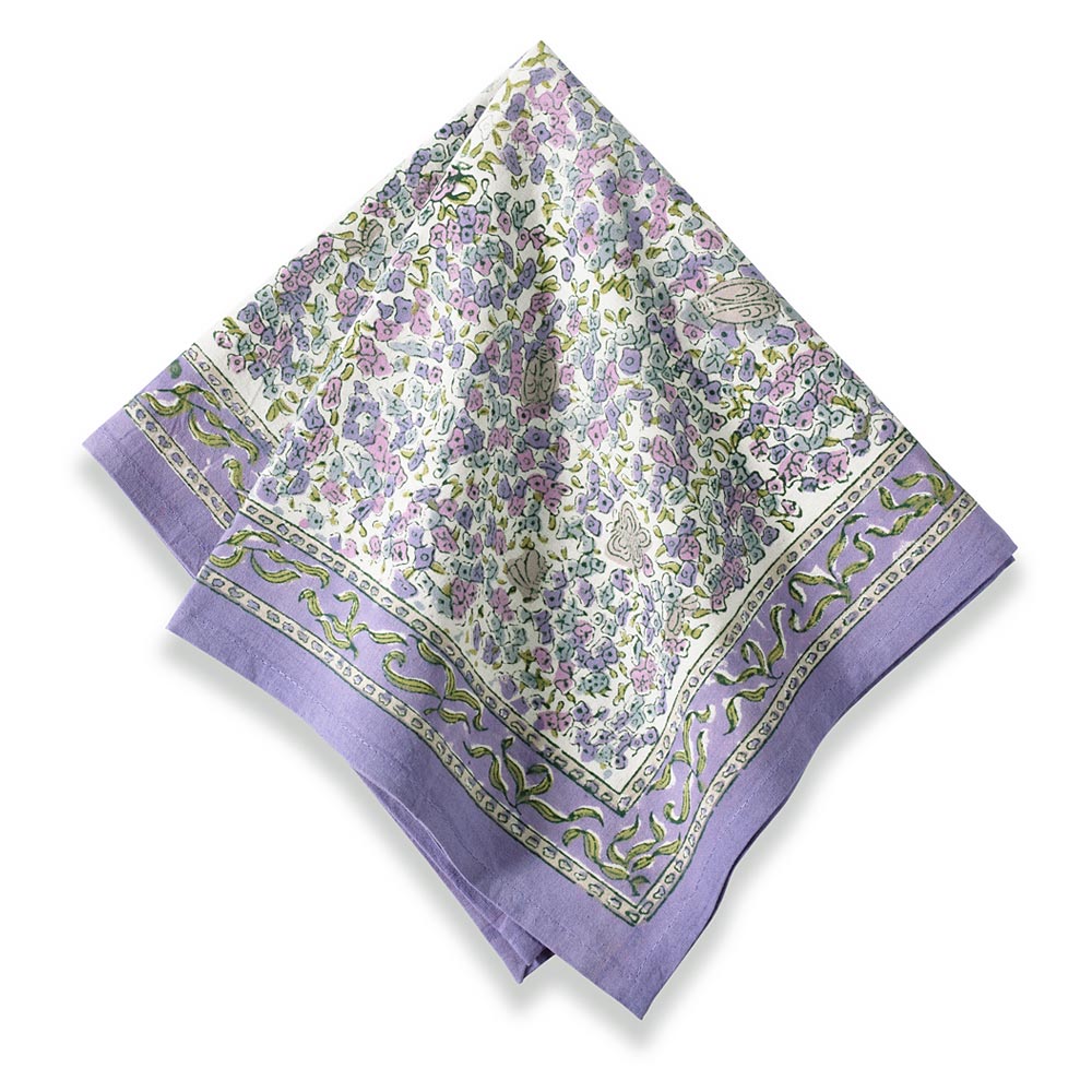 Angled view of Lavender Napkins, Set of 6 showcasing a hand-painted floral pattern with lavender borders on a white background