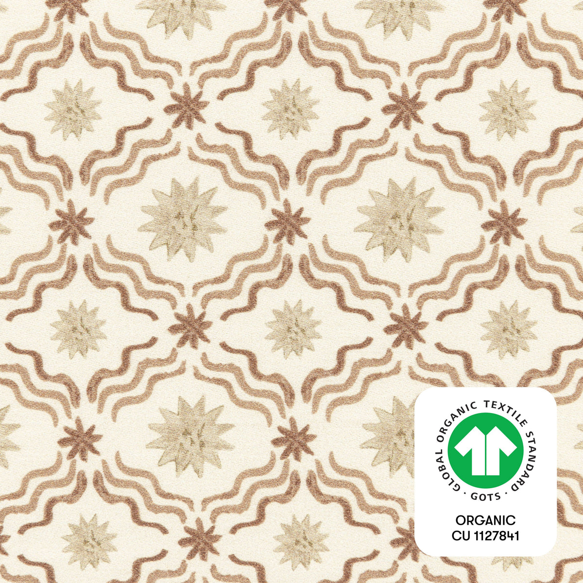 Close-up of Autumn Star crib sheet showcasing a cream star and wave pattern with GOTS organic textile badge