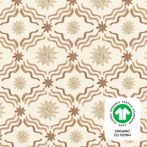 Close-up of Autumn Star crib sheet showcasing a cream star and wave pattern with GOTS organic textile badge