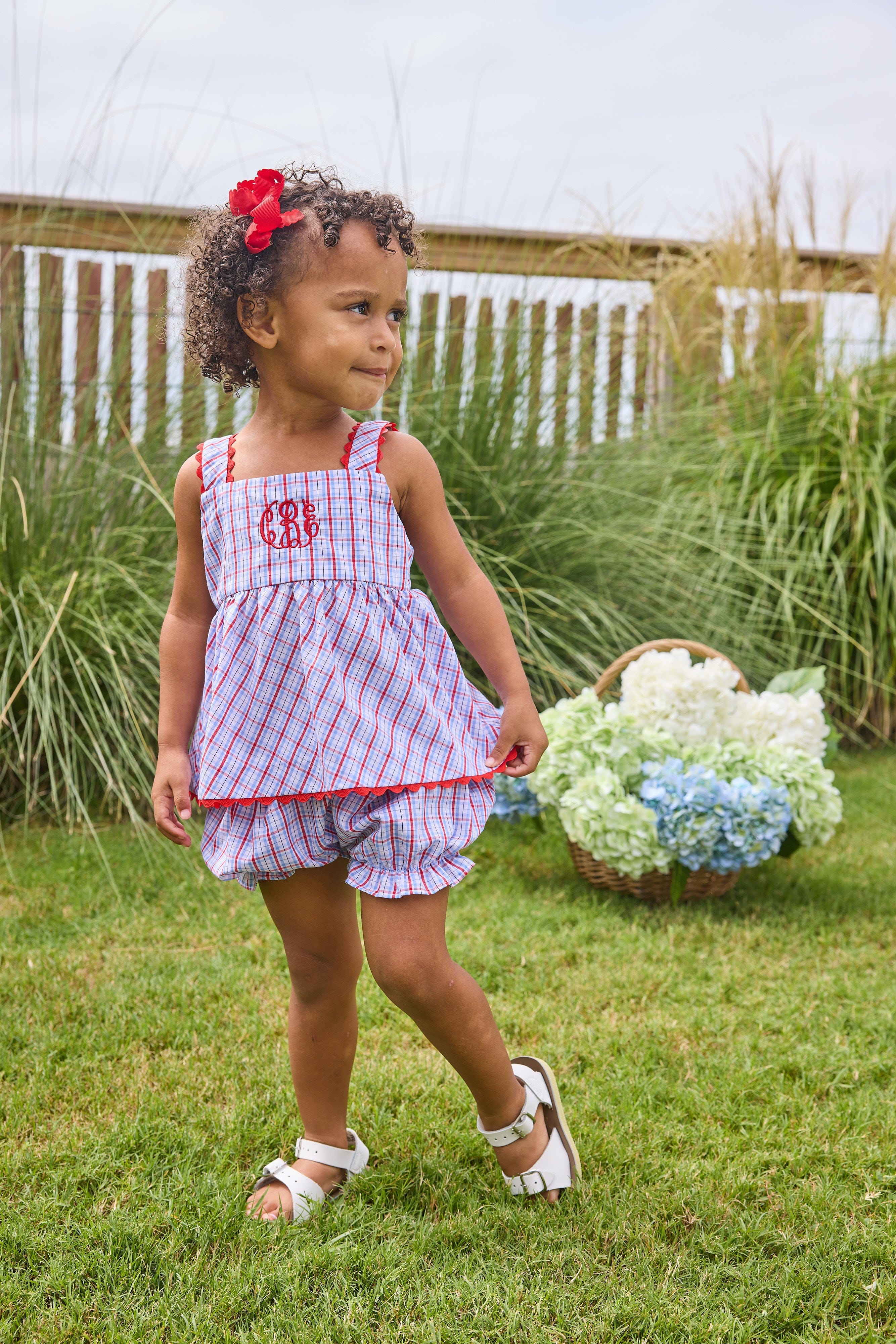 Little English traditional children's clothing.  Patriotic red and blue plaid two-piece set for baby girls.  Tank top with red ricrac trim and matching ruffled bloomers.  4th of July outfit for baby girls