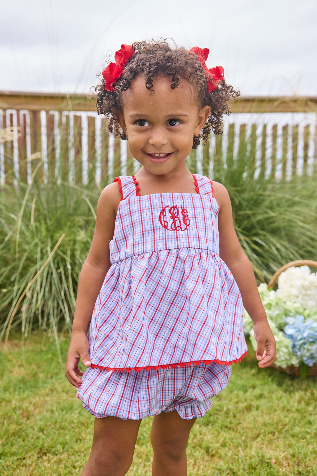 Little English traditional children's clothing.  Patriotic red and blue plaid two-piece set for baby girls.  Tank top with red ricrac trim and matching ruffled bloomers.  4th of July outfit for baby girls
