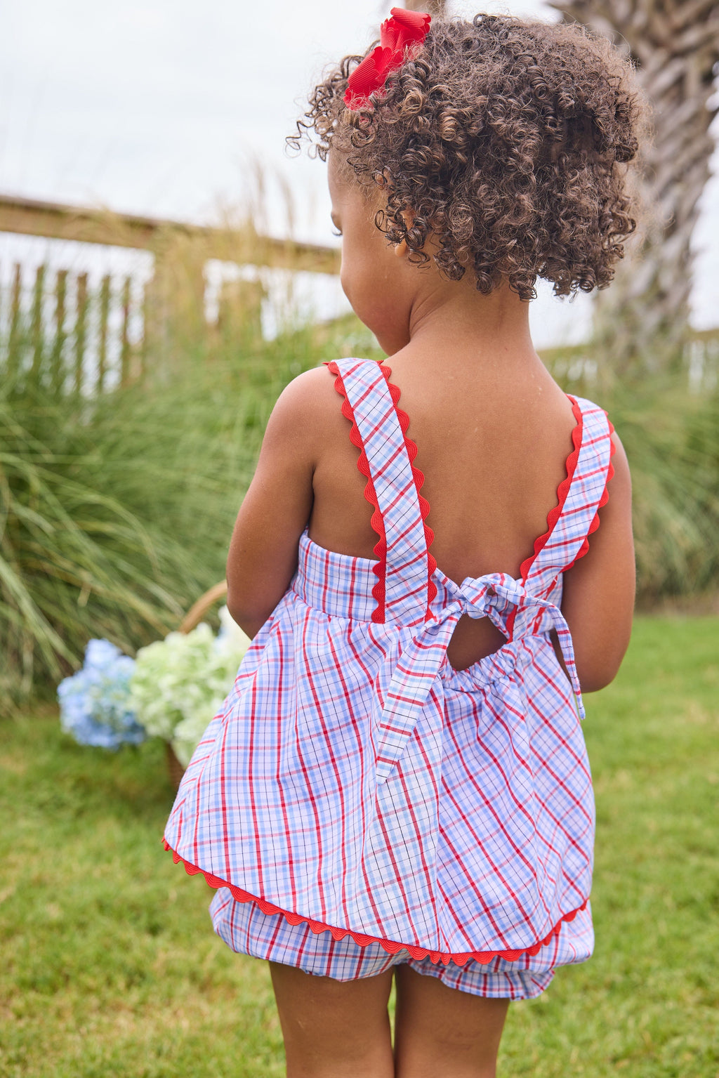 Little English traditional children's clothing.  Patriotic red and blue plaid two-piece set for baby girls.  Tank top with red ricrac trim and matching ruffled bloomers.  4th of July outfit for baby girls