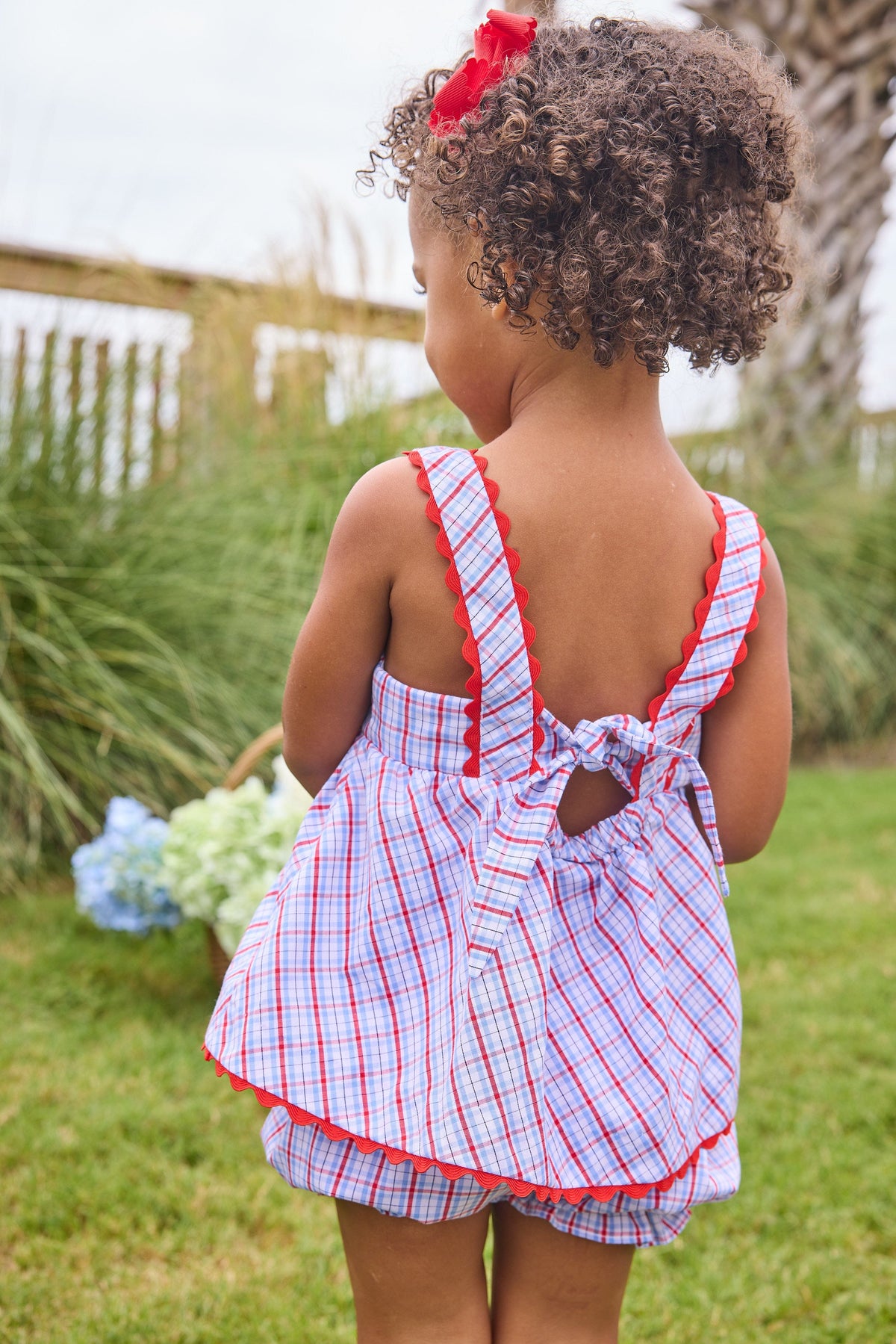 Little English traditional children's clothing.  Patriotic red and blue plaid two-piece set for baby girls.  Tank top with red ricrac trim and matching ruffled bloomers.  4th of July outfit for baby girls