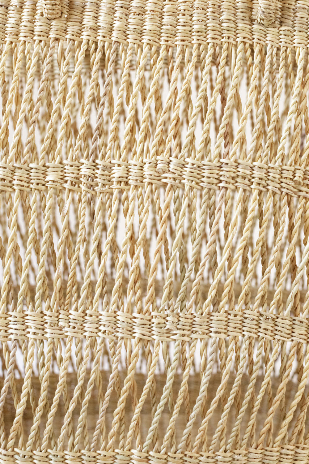 Close up of Large Open Weave Bolga Tote showing natural raffia open lattice weave and twisted fringe