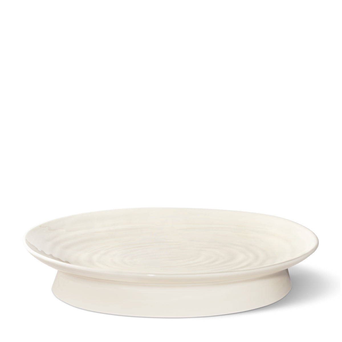 Front view of Allette Pedestal Oval Platter in Cream showcasing delicate ribbing and pedestal base on a white background