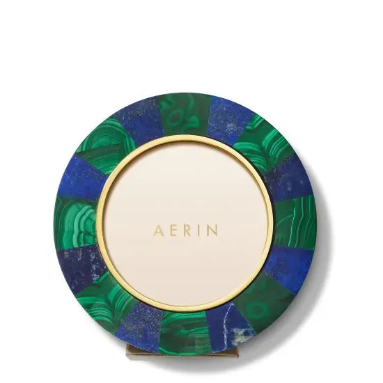 Front view of Cassiel Mosaic round frame showing alternating lapis and malachite stone segments and a gold inner rim on white