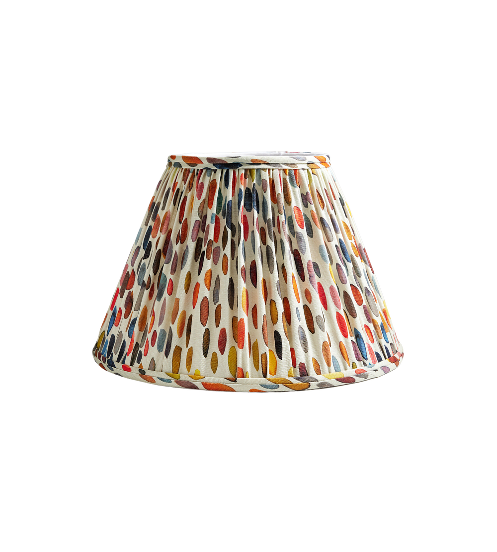 Front view of Jamboree Pleated Shade showcasing multicolored brush-stroke dot pattern on cream fabric against a black background