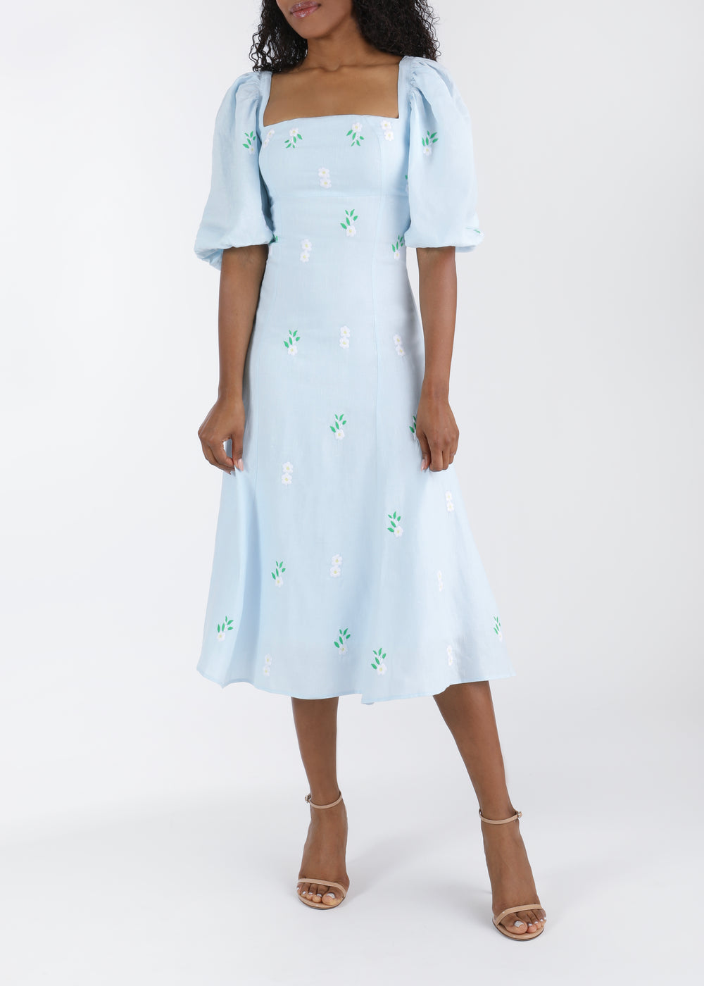 Front view of Savannah midi dress with square neckline, puff sleeves, fitted waist and white floral embroidery on light blue