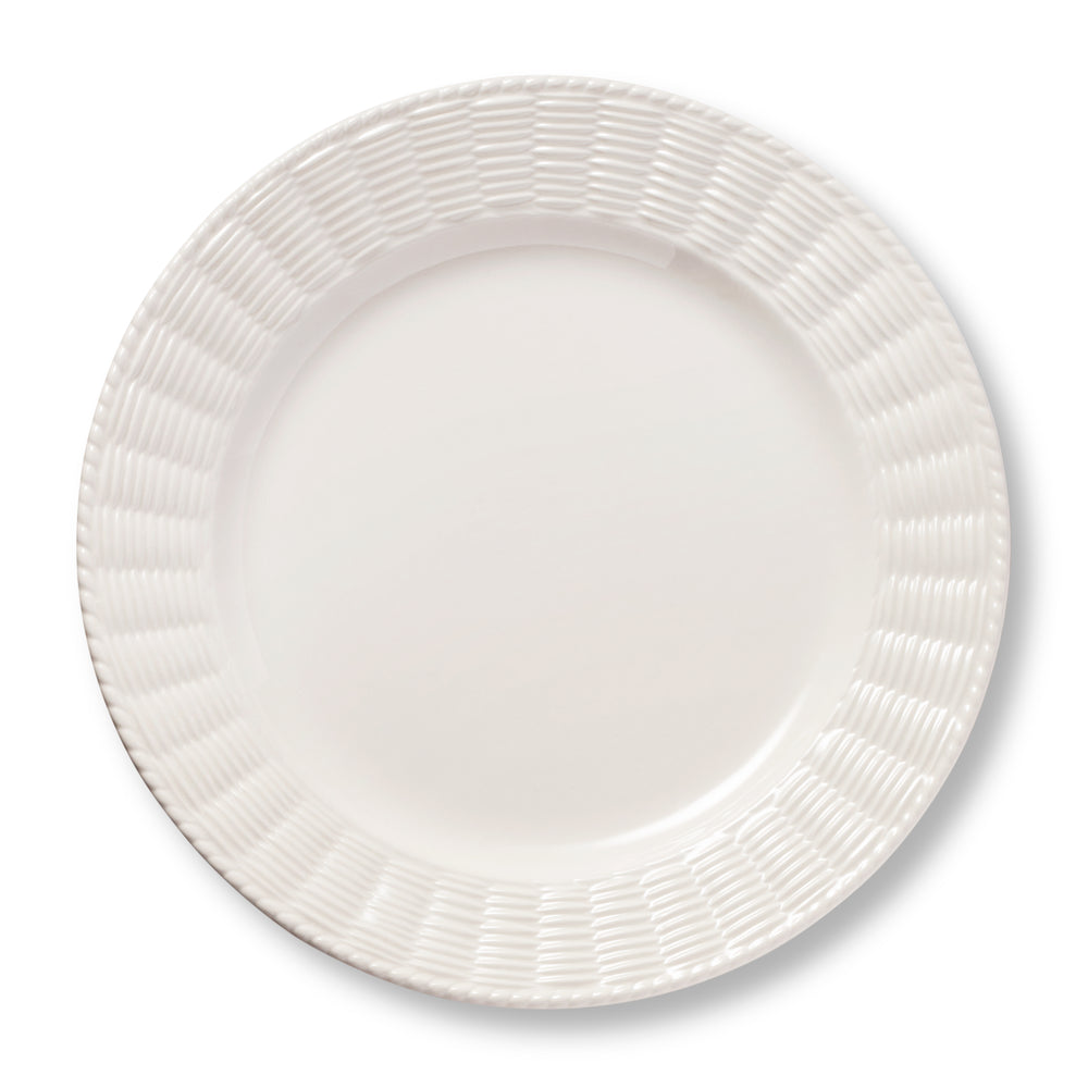 Top view of Leta Dinner Plate showcasing its white ceramic finish and rattan inspired textured trim on a white background