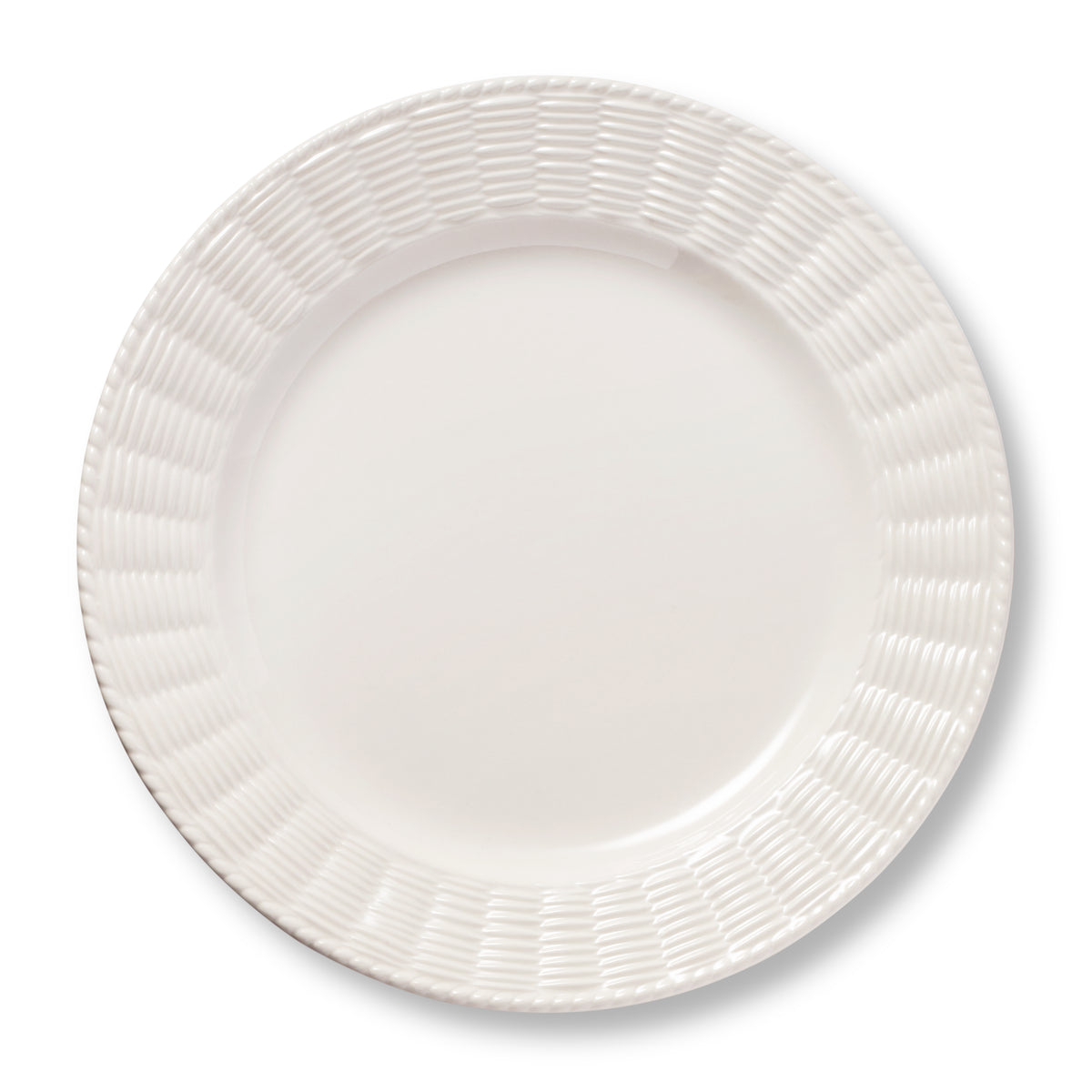 Top view of Leta Dinner Plate showcasing its white ceramic finish and rattan inspired textured trim on a white background