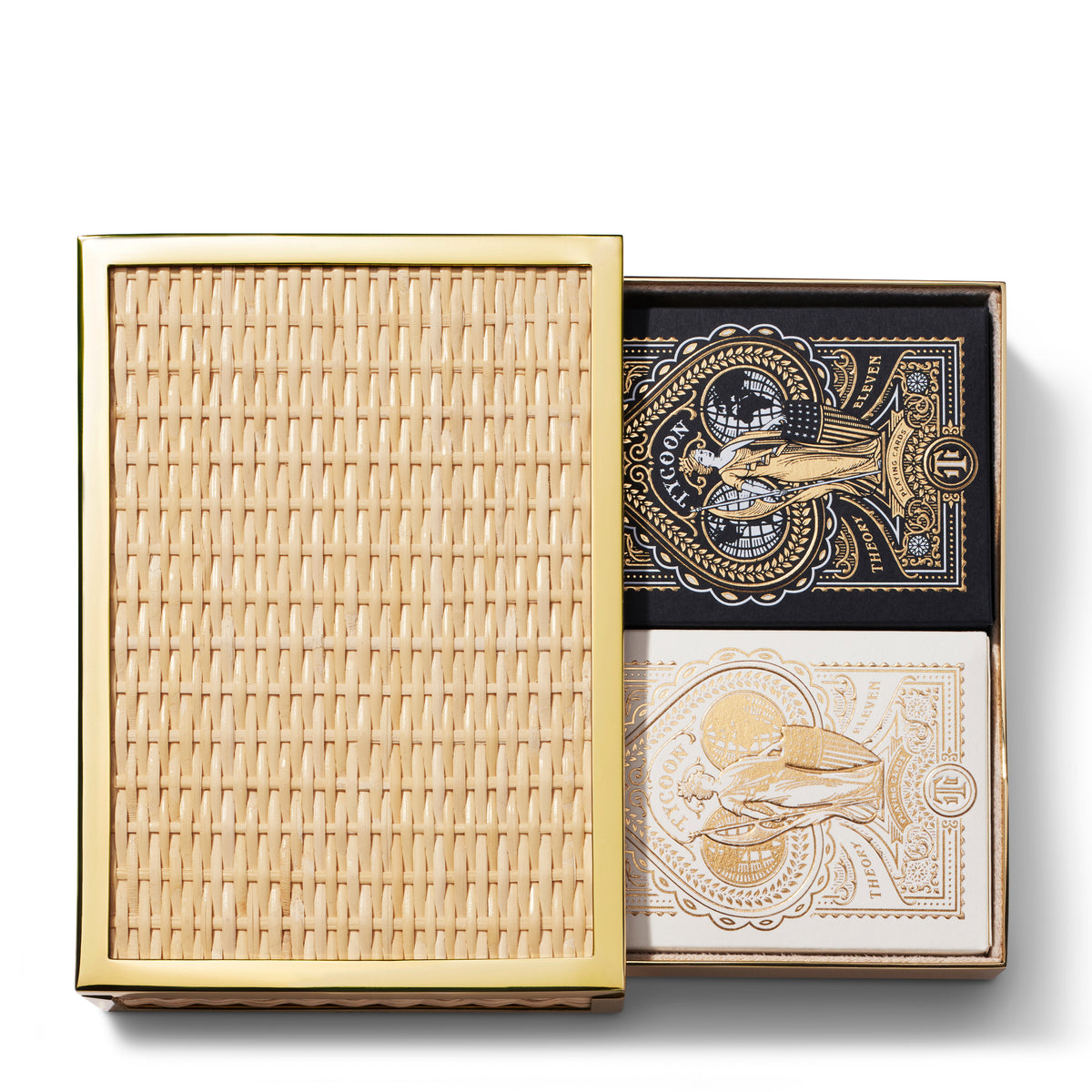 Top view of Colette Cane card set showing woven cane case with brass trim and two ornate black and white decks on white
