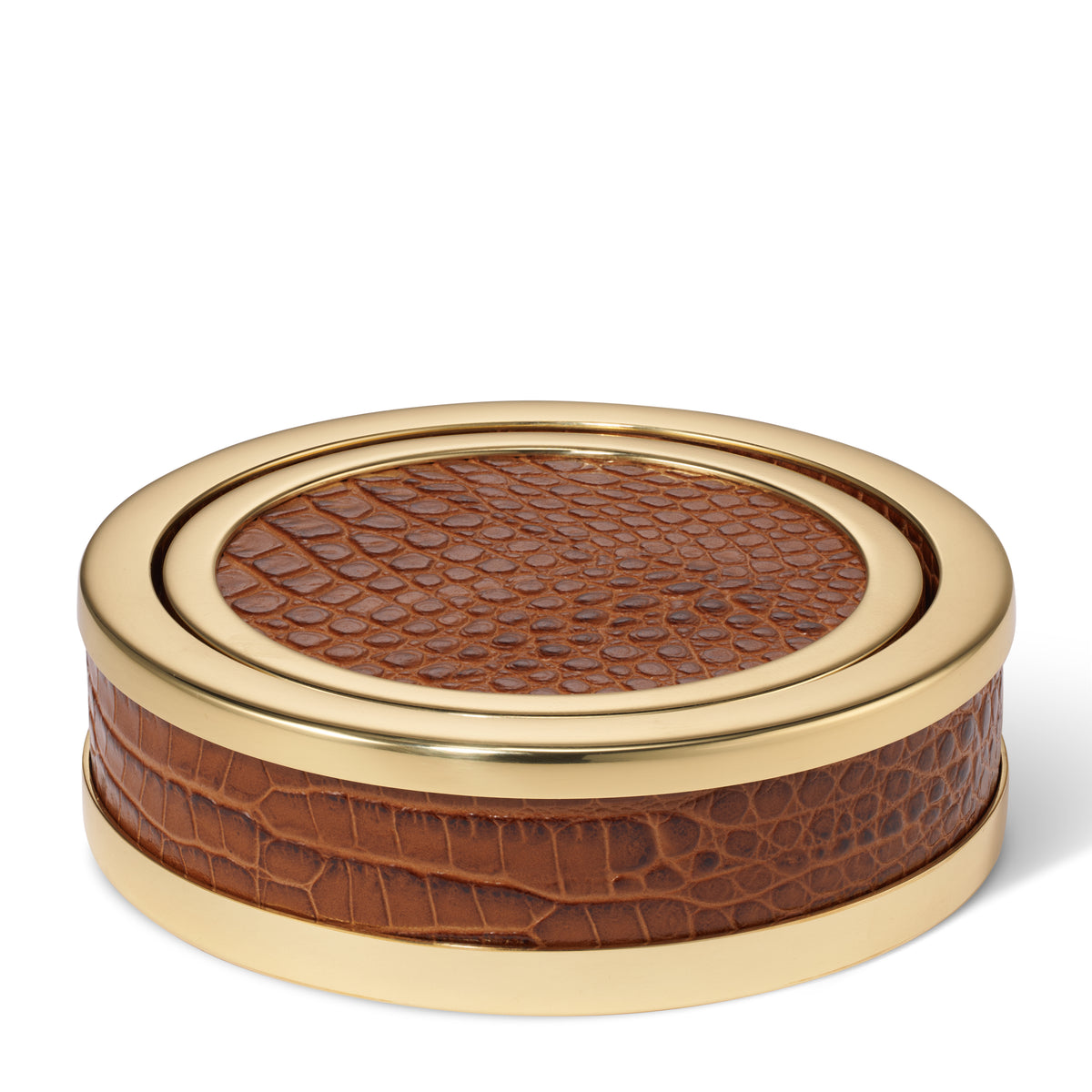 Close-up of chestnut croc embossed leather coaster set with gold-toned brass detailing on white
