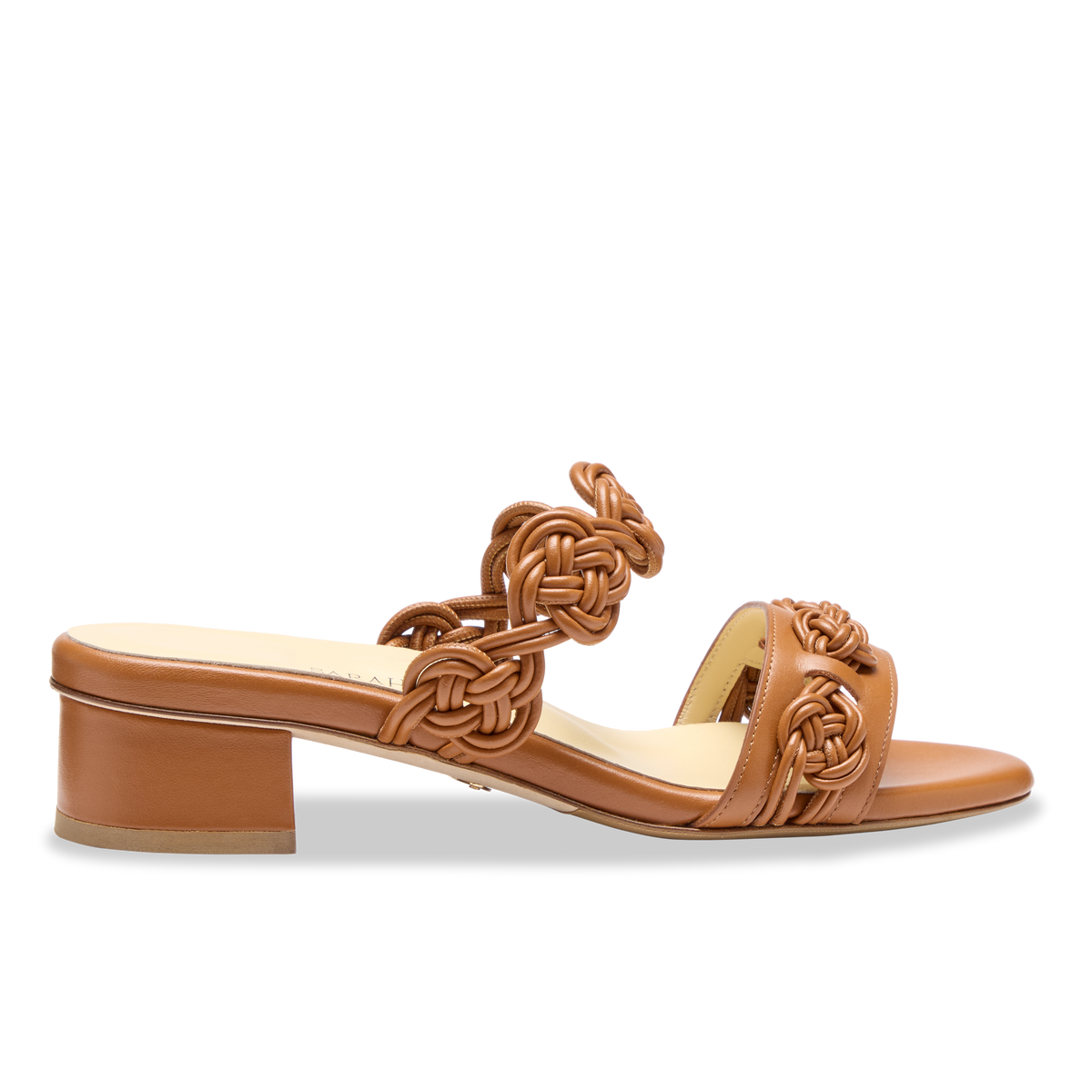 Side view of Perfect Celeste 30 in Cognac Calf showcasing handmade knot detailing and inset block heel on white background