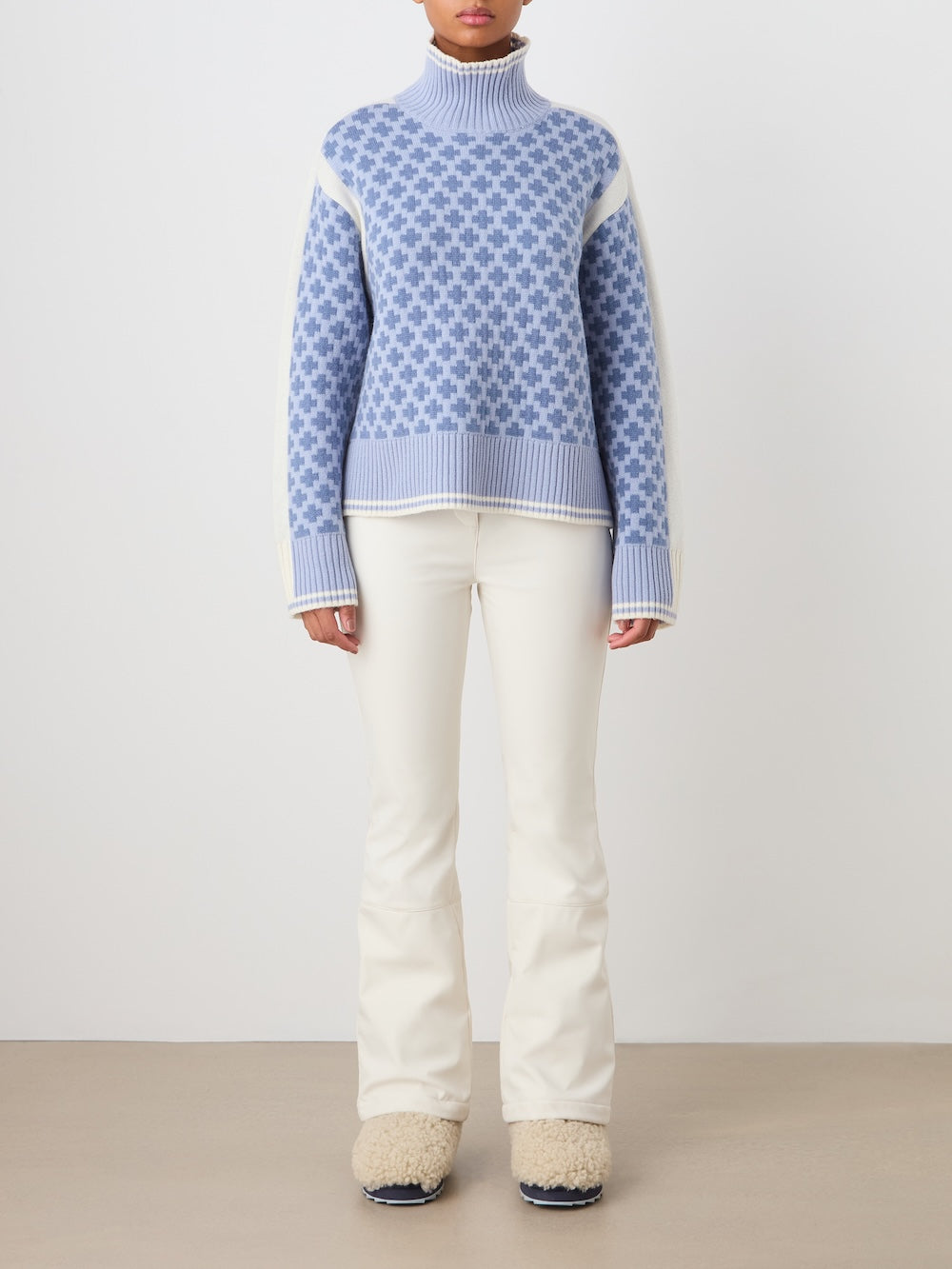 Front view of the Boat Sweater in Light Blue showcasing its oversized fit and contrasting panels on a model against a white studio background