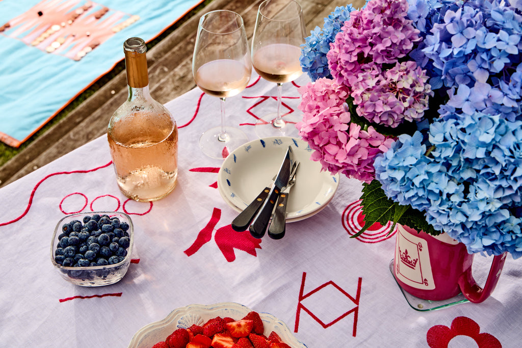 Close up of table set with fruit and wine - mahjong linen tablecloth