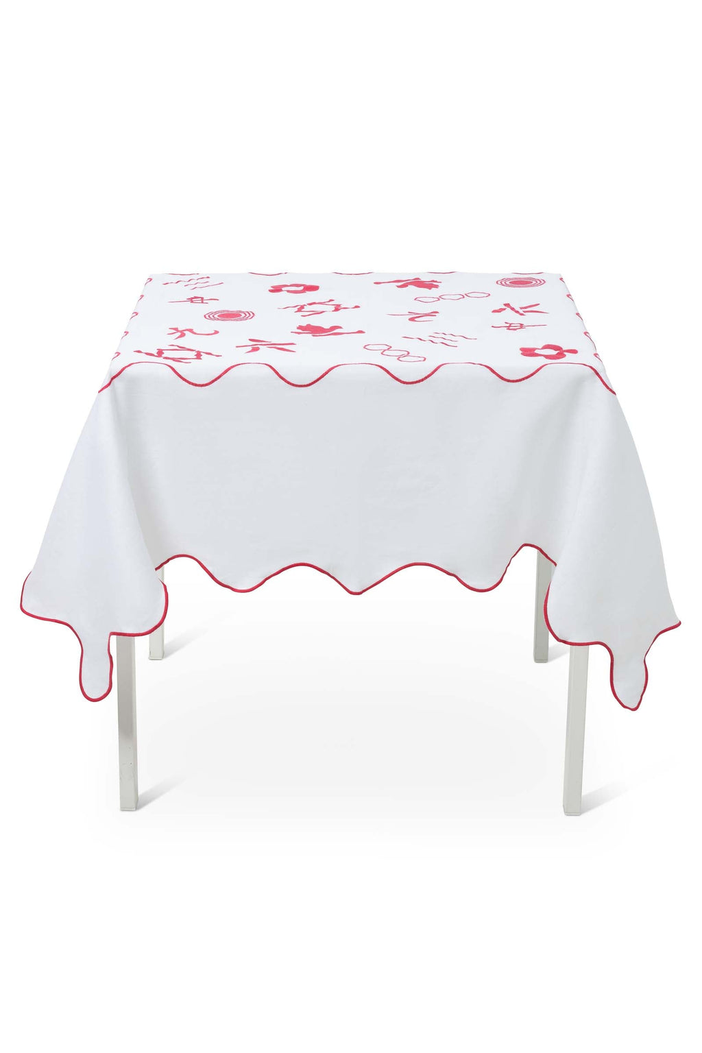 Pink & white 100% linen embroidered tablecloth that is Mahjong themed, scalloped edges - side angle