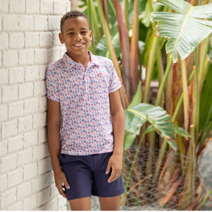 Henry Duvall boys patriotic performance polo with red white and blue fireworks and flag print, preppy UPF summer shirt for Memorial Day, 4th of July, and everyday wear