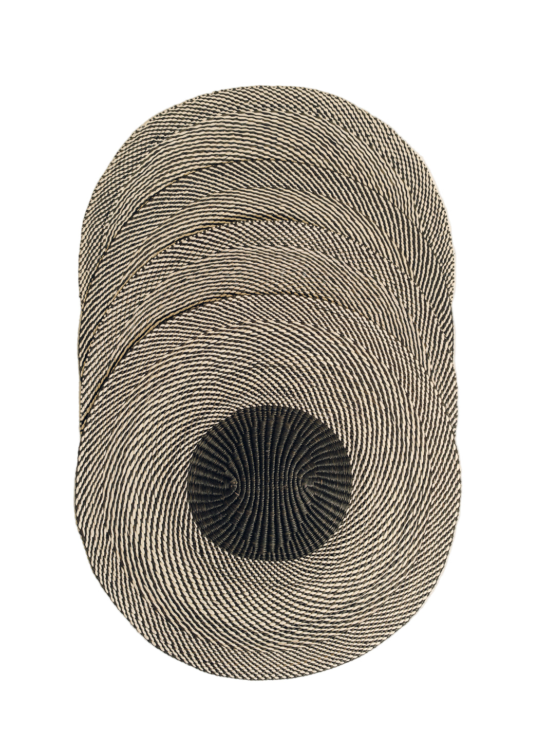 Top view of woven placemat set of four showing natural and black braided concentric pattern with white background