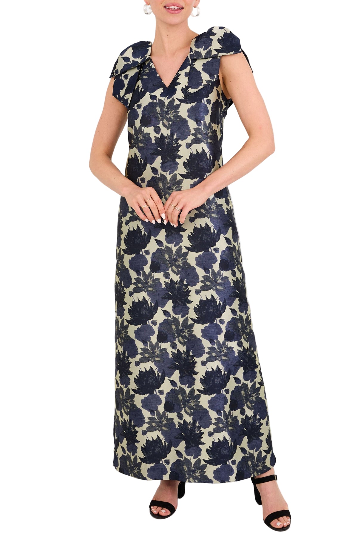 Front view of Meredith Gown in Ivory and Navy Floral Silhouette Jacquard with V-neckline and bow shoulder detail