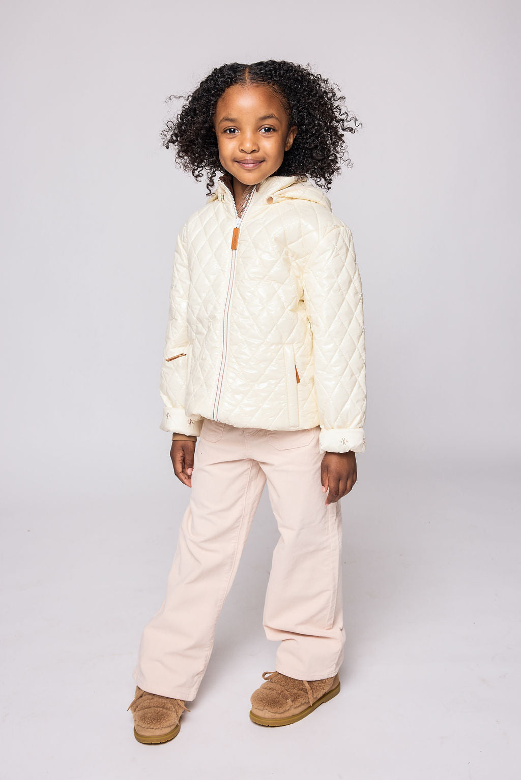 Kids and women shiny white puffer jacket for fall and winter, designed as a warm in-between layer with removable hood, insulated core, and water-resistant fabric