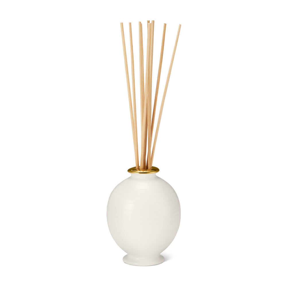 Front view of Siena L’Ansecoy Orange Blossom Diffuser Set showcasing cream ribbed ceramic vessel, gold rim, and reeds on white