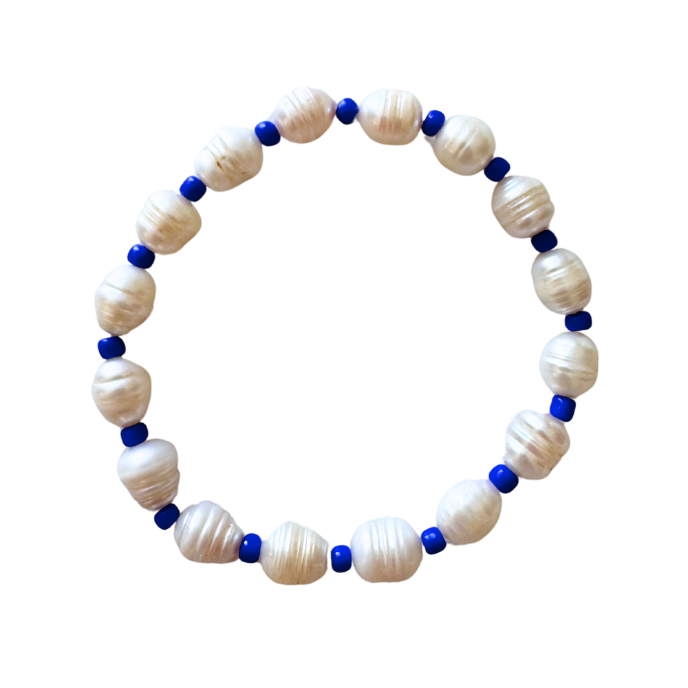 Top view of Blue Pearl anklet showing alternating freshwater pearls and cobalt blue spacer beads on white background