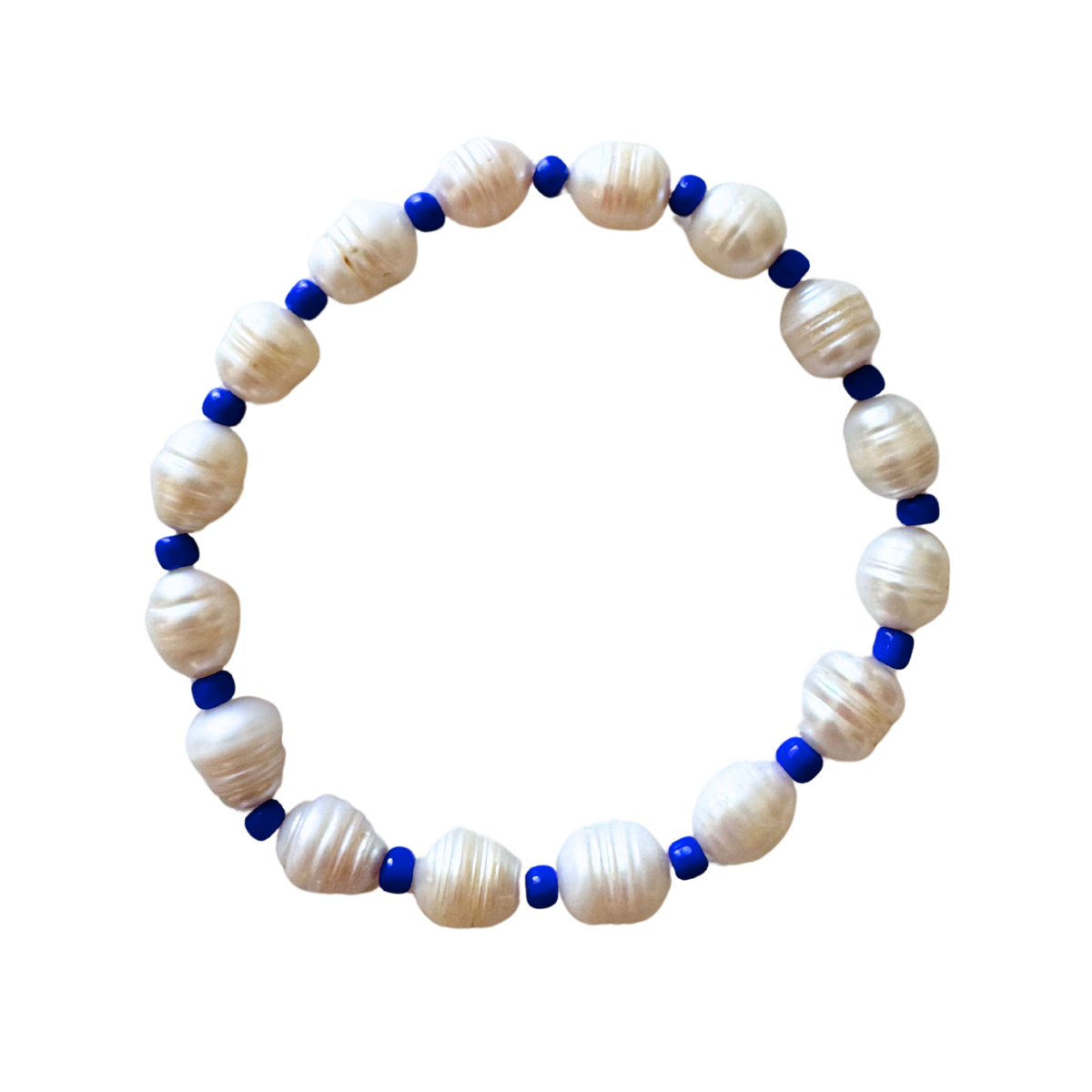 Top view of Blue Pearl anklet showing alternating freshwater pearls and cobalt blue spacer beads on white background