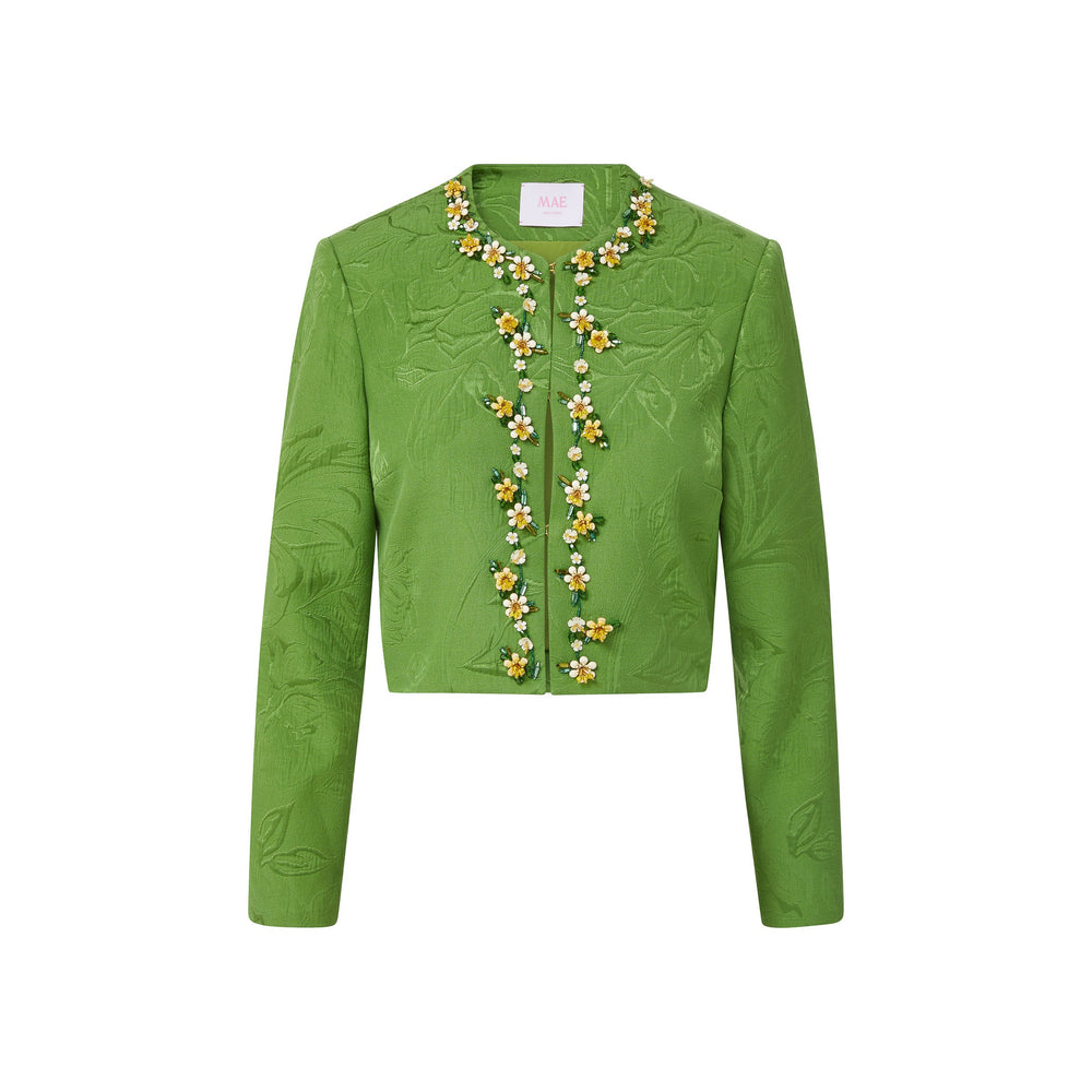 Front view of Blaire jacket in pistachio brocade showcasing floral embellishments and a cropped fit on a white background