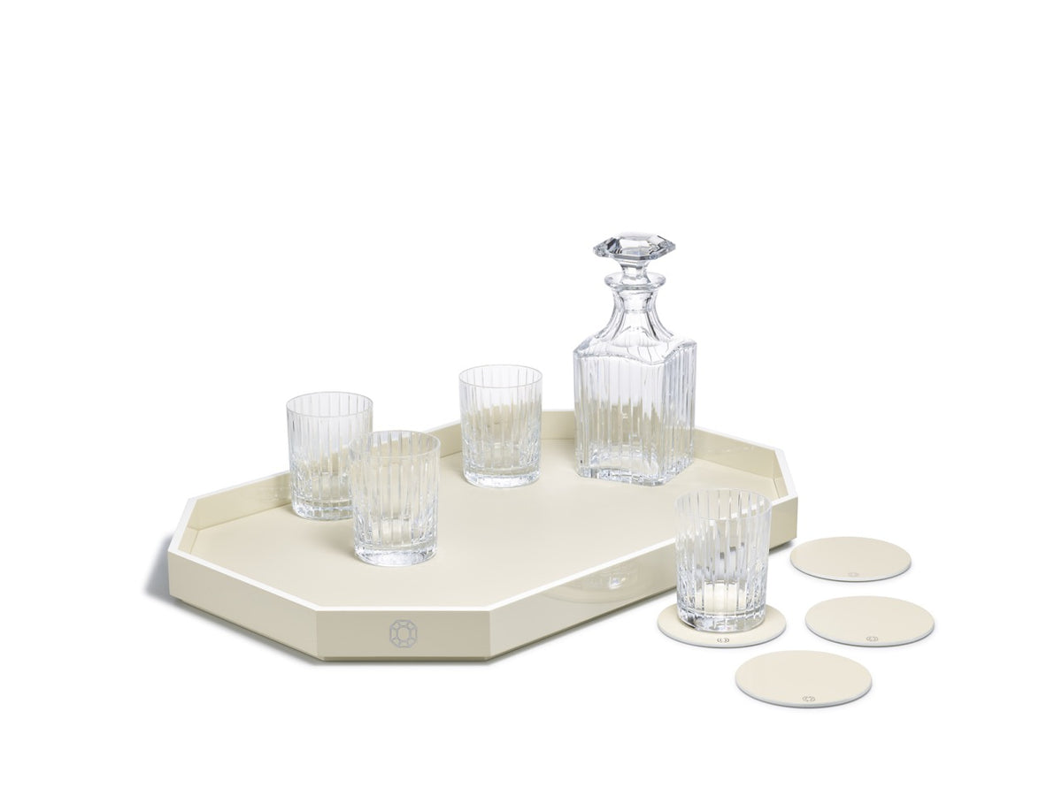 View of Octogone Coasters in Ivory, Set of 4 showcasing lacquered finish with glassware on a white background