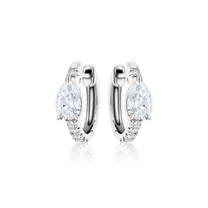 The Pavé Huggie with Pear Diamonds earrings showcase a large teardrop-shaped clear gemstone and smaller round stones on the front, beautifully displayed on a white background.