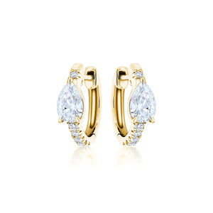 Pavé Huggie with Pear Diamonds: 18k gold hoop earrings with a pear-shaped diamond center and small round stones along the front, shown on a white background.
