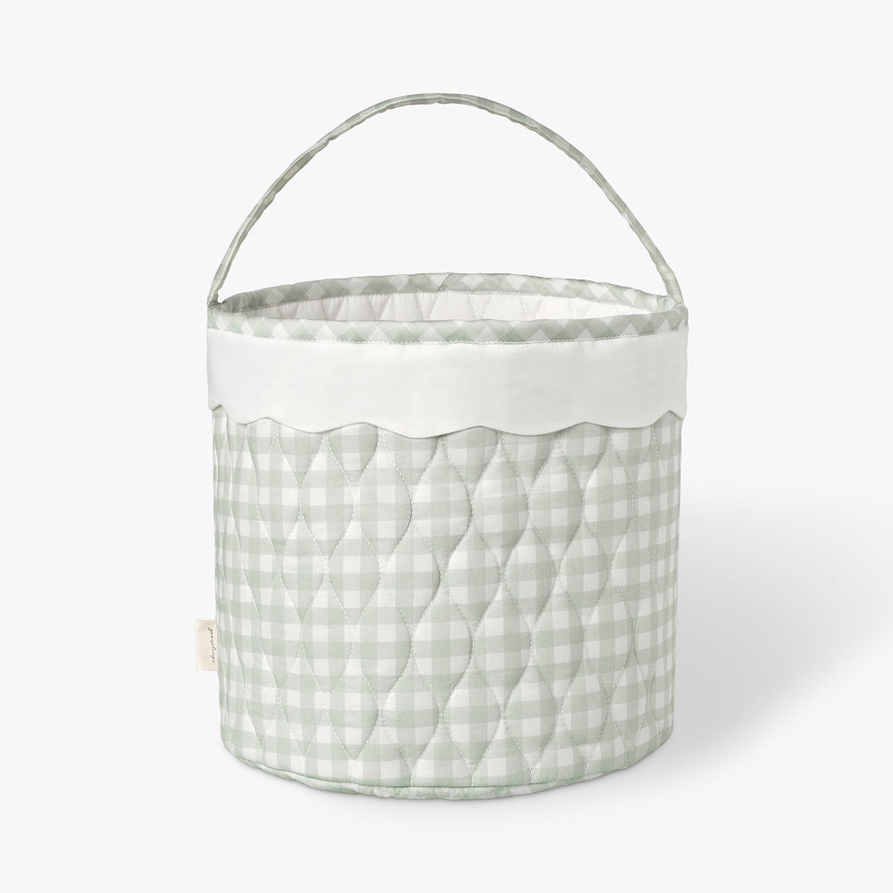 Quilted fabric basket with a green checkered pattern on a white background