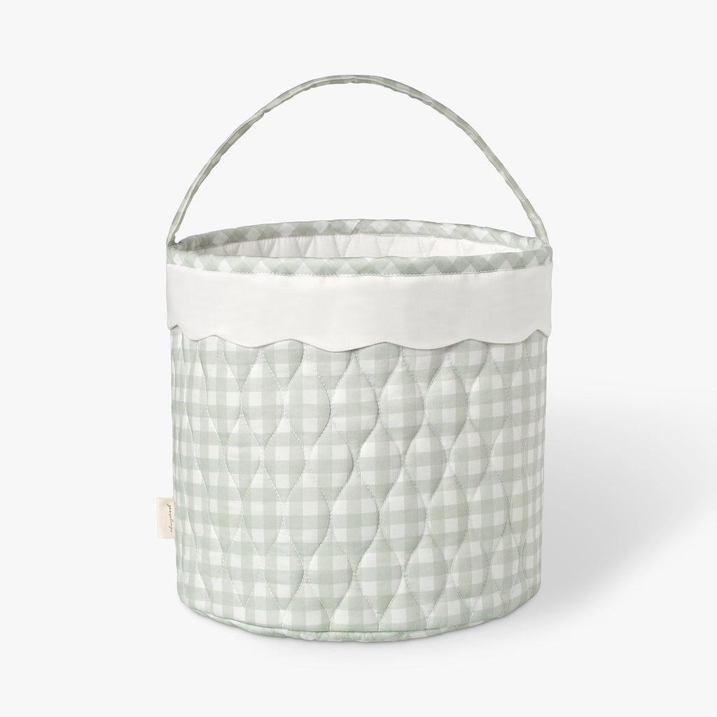 Quilted fabric basket with a green checkered pattern on a white background