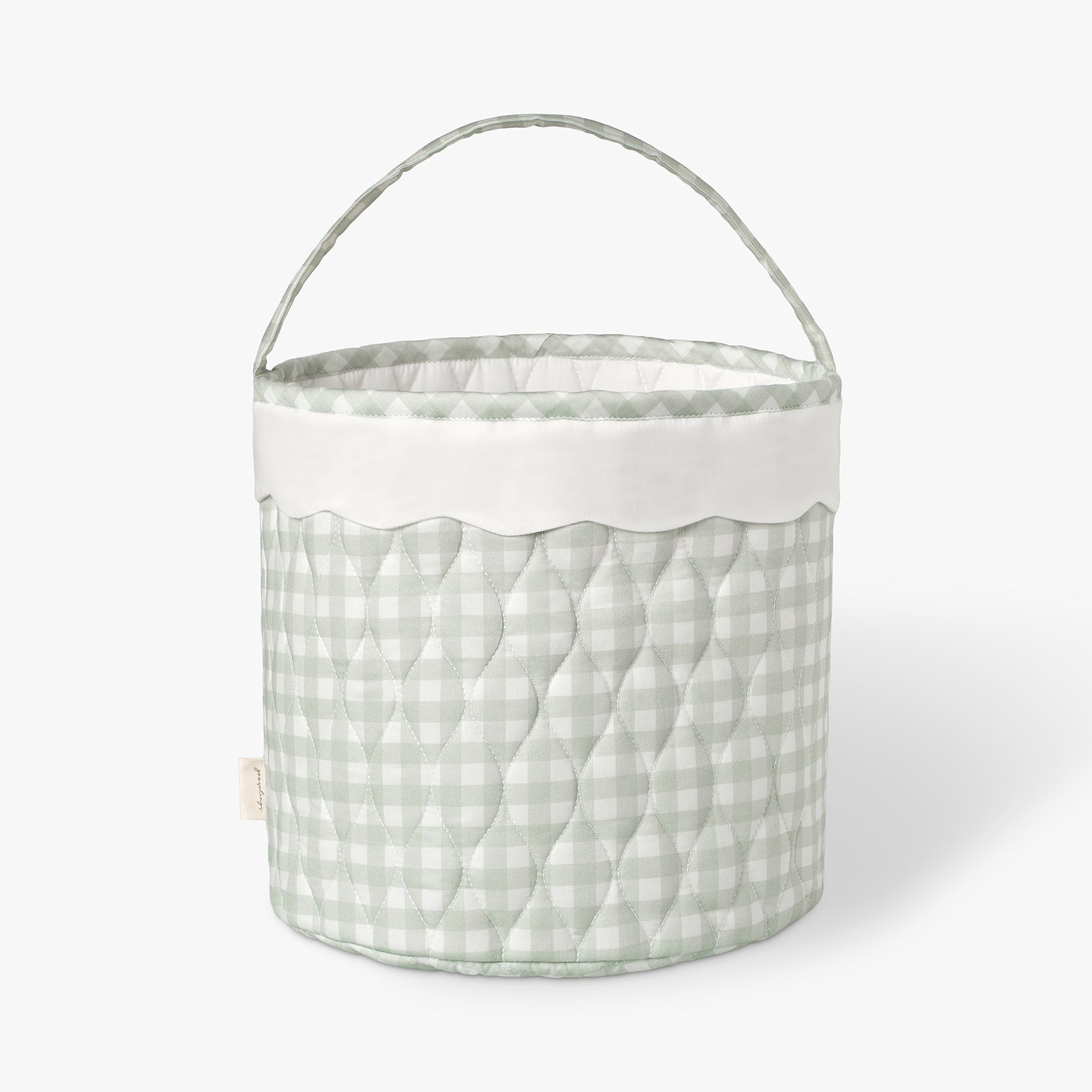 Quilted fabric basket with a green checkered pattern on a white background