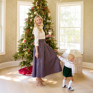Women’s Audrey Skirt in navy, red, and green Tinsel Tartan with subtle metallic thread, featuring a full gathered midi-length silhouette.