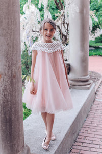 Girls pink tulle dress with flower details and lace styled for a special occasion 
