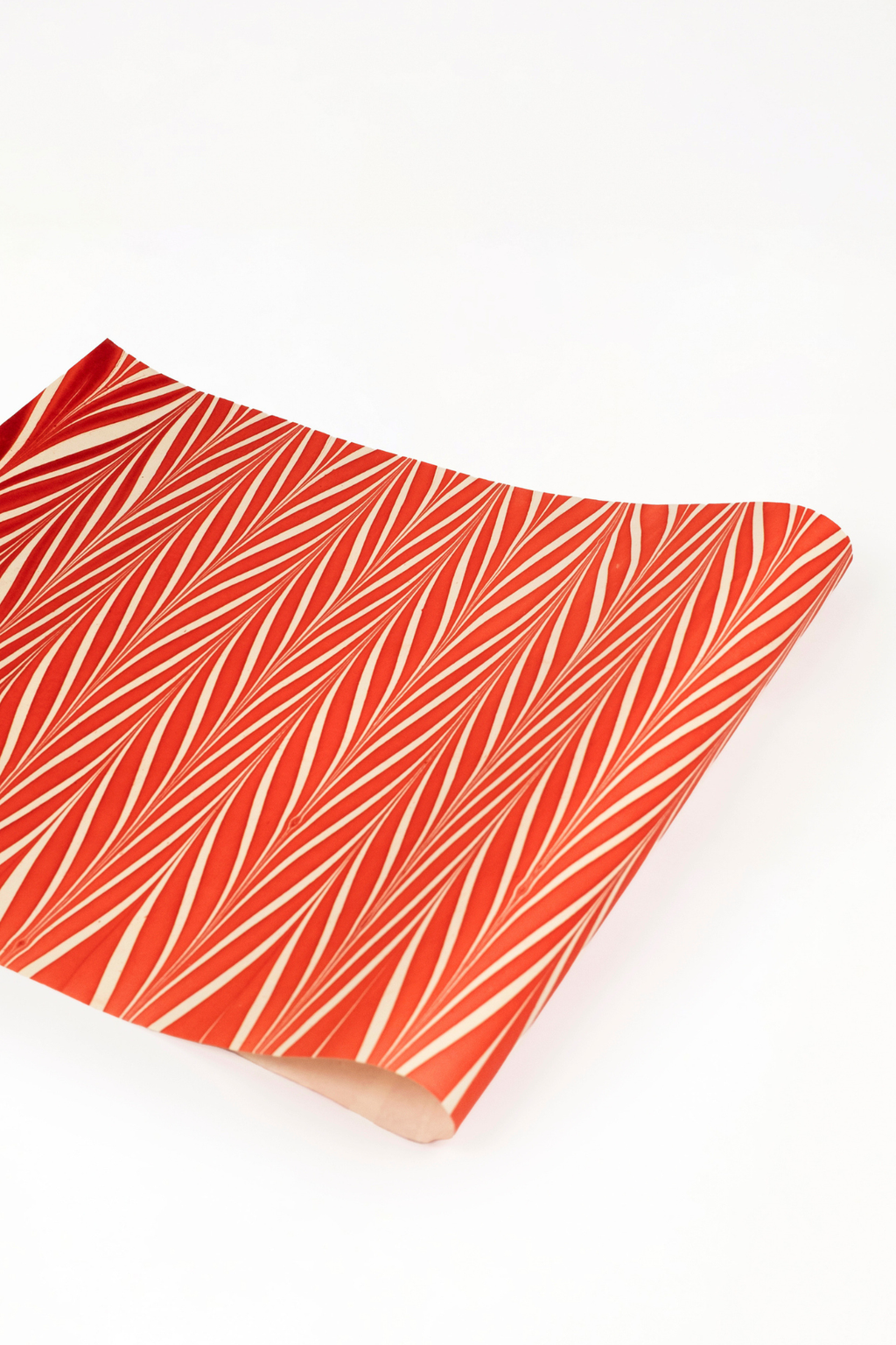 Red and white striped hand marbled candy cane gift wrapping paper sheet