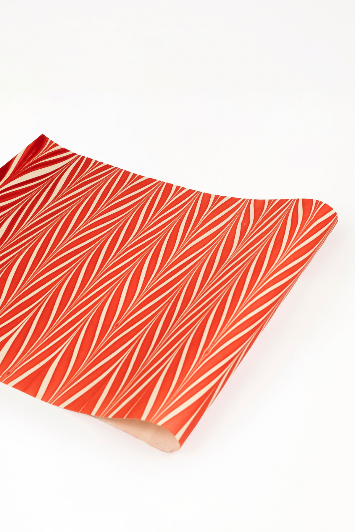 Red and white striped hand marbled candy cane gift wrapping paper sheet