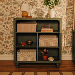 Front view of Astre Assembled Bookcase by Nate Berkus in Archival Elm with open shelves and rounded feet