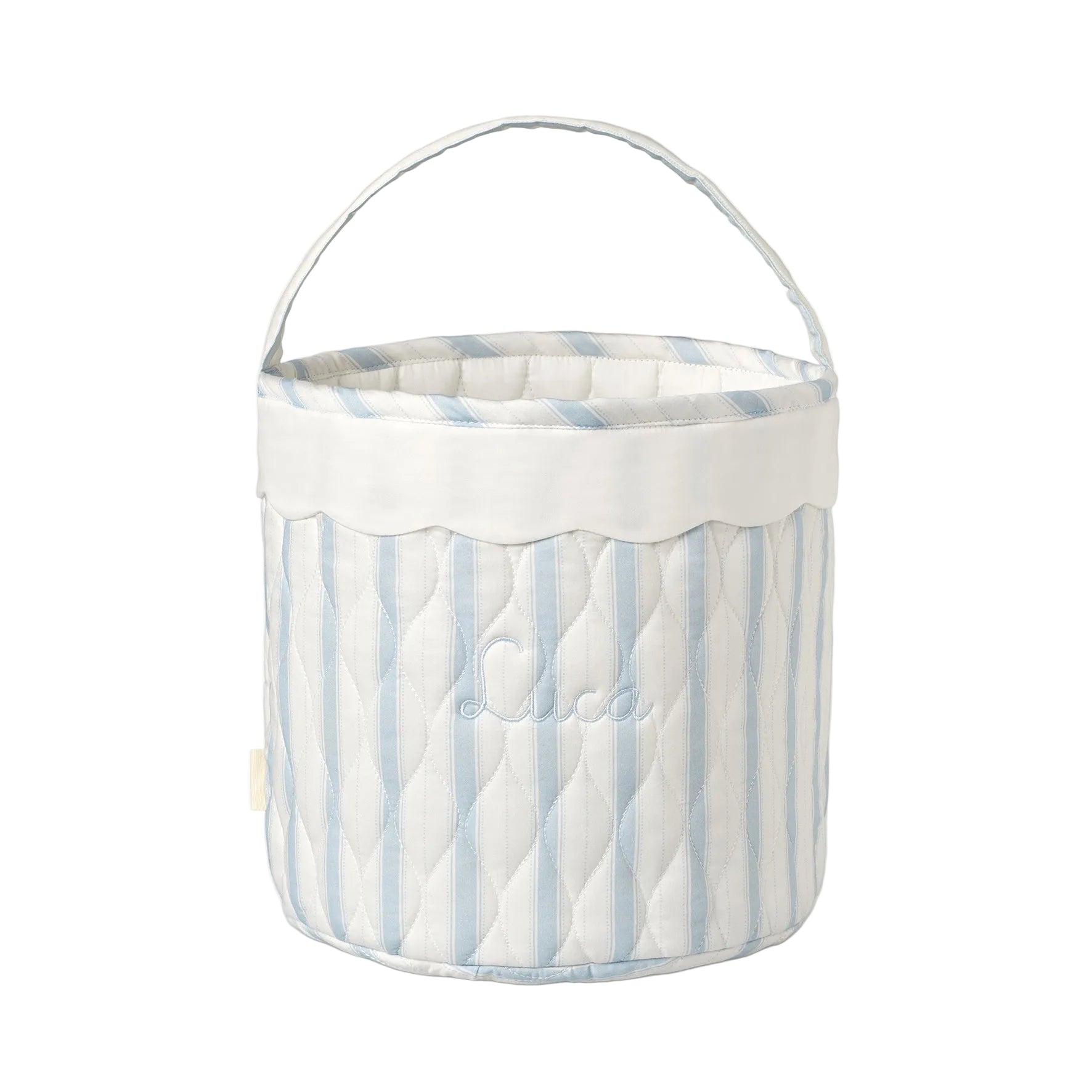 Blue ad white striped quilted basket with handle on while background.