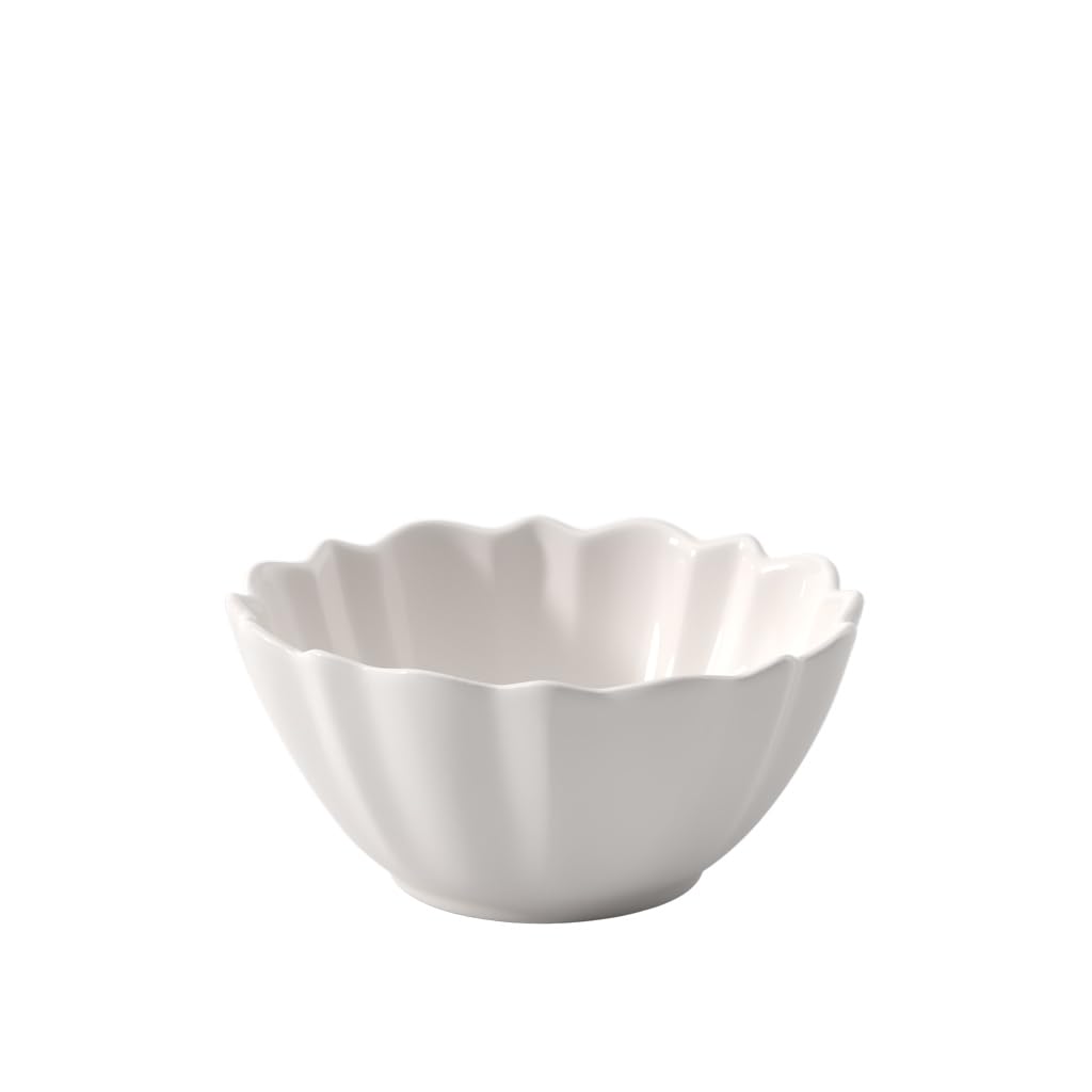 Three-quarter view of Toys Delight Royal Classic bowl showcasing scalloped fluted rim and glossy white porcelain on white background